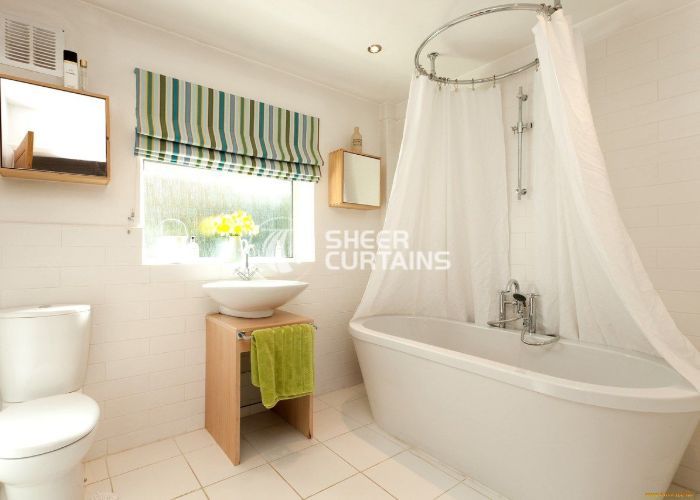 White flooring with bathroom curtains